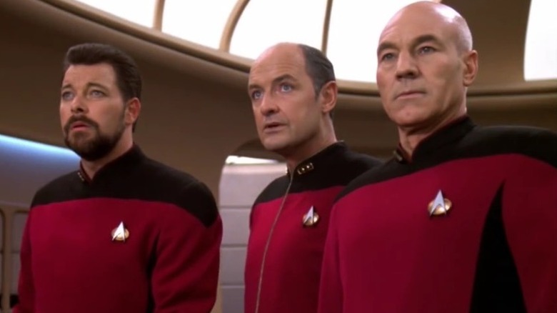 Riker, Admiral Pressman, and Picard on the bridge in Star Trek: The Next Generation (1987)