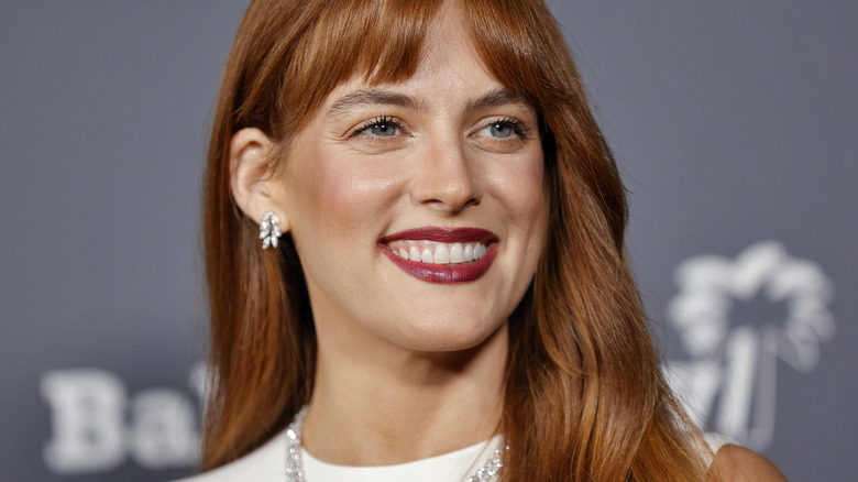 Riley Keough smiling at a premiere