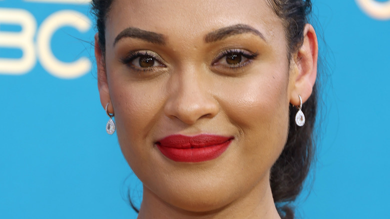 Cynthia Addai-Robinson earrings bold lipstick