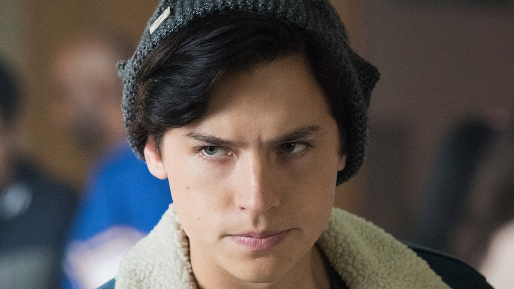 Jughead scowling in jacket