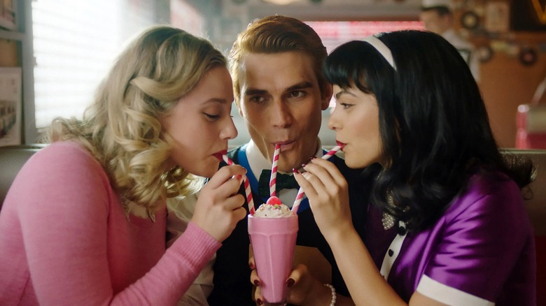 Archie, Veronica, and Betty drinking milkshakes