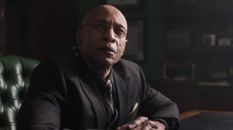 Principal Weatherbee sitting at his desk