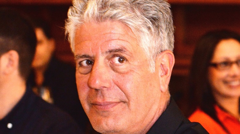 Anthony Bourdain looking on