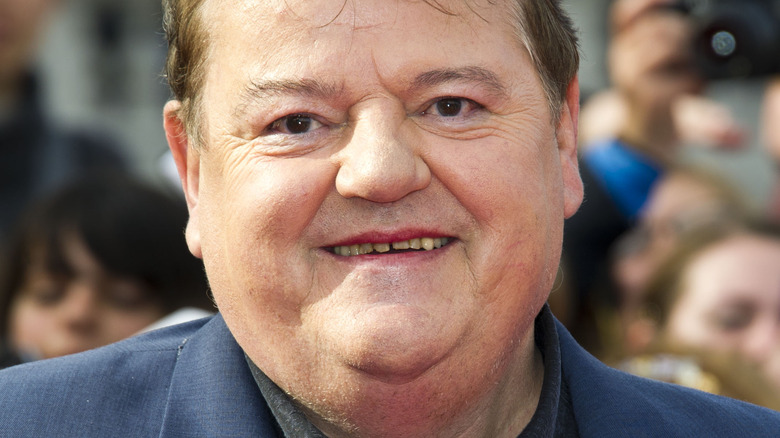 Robbie Coltrane grinning