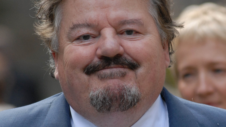 Robbie Coltrane smiling at event