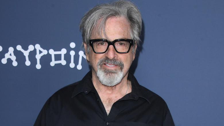 Robert Carradine with glasses and a black shirt