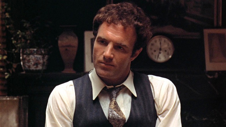Sonny Corleone sitting listening in 
