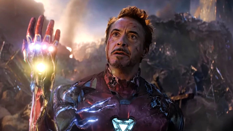 Iron Man holds up the Infinity glove