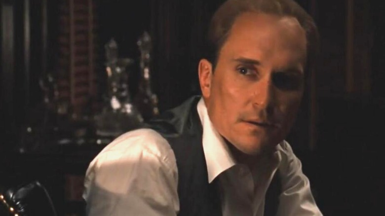 Tom Hagen in shadows, face pensive, from The Godfather.
