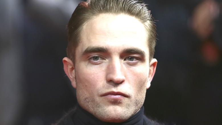 Robert Pattinson with slicked-back hair