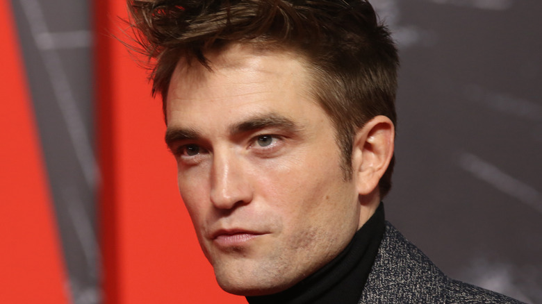 Robert Pattinson attends event 