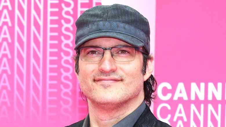 Robert Rodriguez wearing hat and glasses