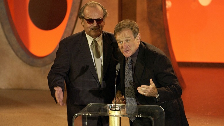 Jack Nicholson and Robin Williams at the podium during an awards ceremony