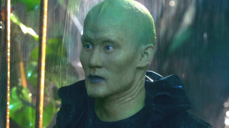 Triton wearing black coat