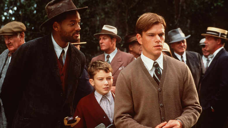 Bagger talks to Junnuh on the golf course in The Legend of Bagger Vance (2000)