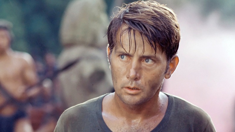 Capt. Benjamin L. Willard standing among Col Kurtz's men in "Apocalypse Now"