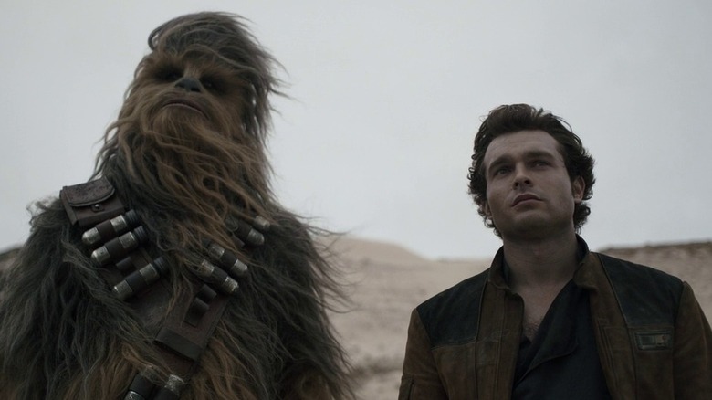 Young Han Solo standing by Chewbacca