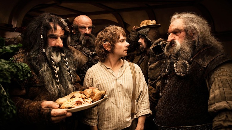 Bilbo Baggins surrounded by dwarves