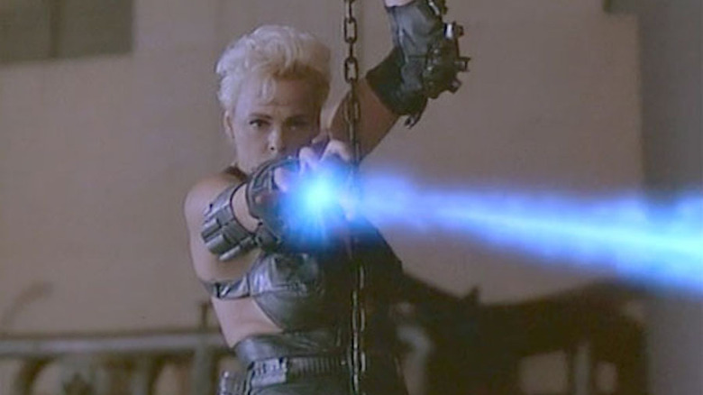 Ladera shoots an energy beam from her hand