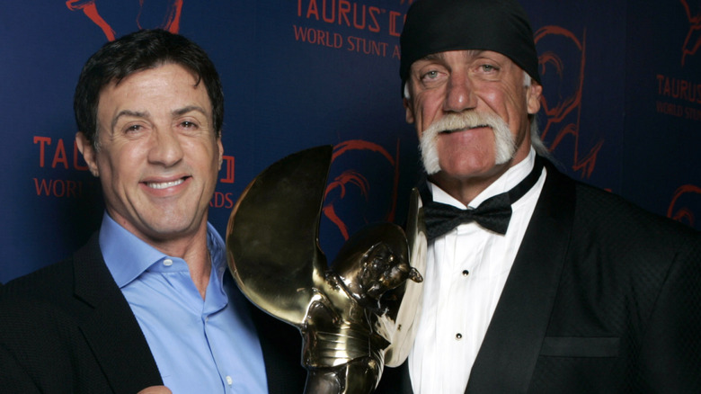 Stallone and Hogan pose together for a picture at the World Stunt Awards