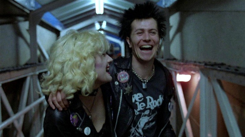 Sid and Nancy laughing together in a tunnel in "Sid and Nancy" (1986)