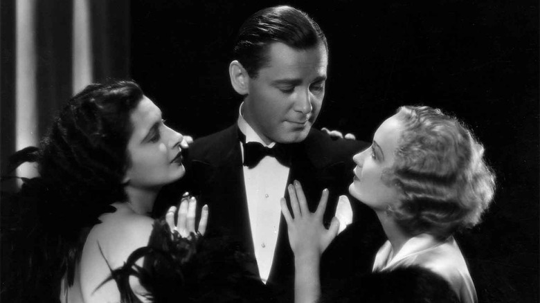 Mariette and Lily clinging to Gaston in "Trouble in Paradise" (1932)