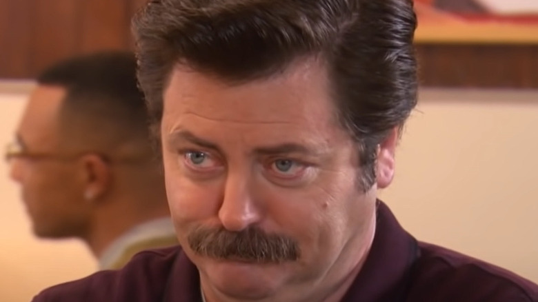 Ron Swanson listening to Leslie