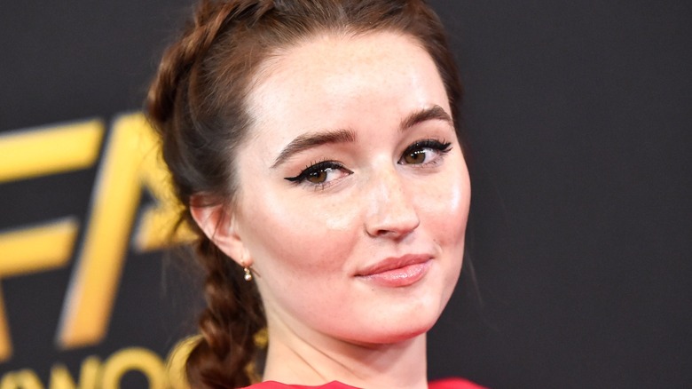 Kaitlyn Dever smiling at public event