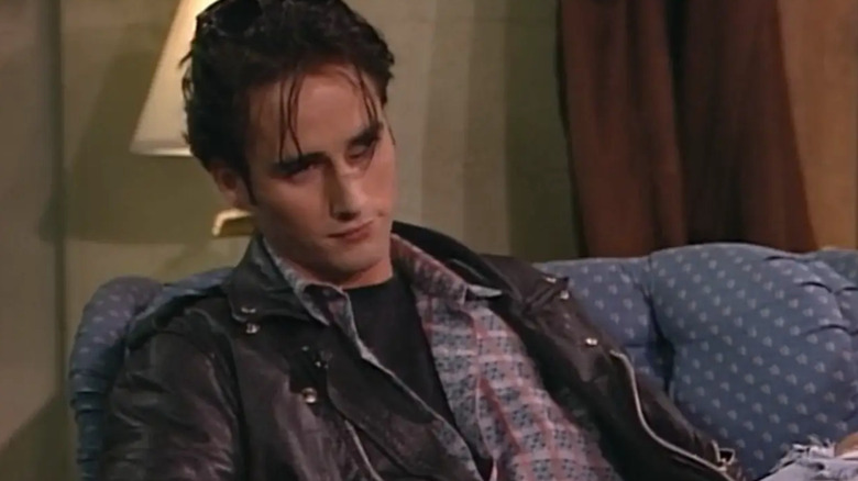 Glenn Quinn sitting down