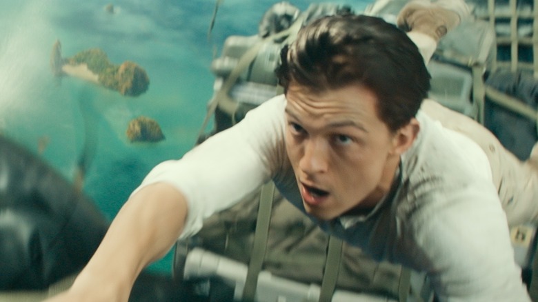Holland holds on during an action scene in Uncharted