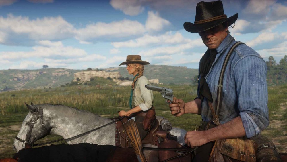 Arthur and Sadie ride on their horses