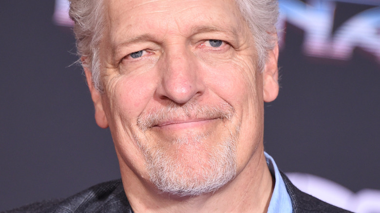 Clancy Brown smirks wryly