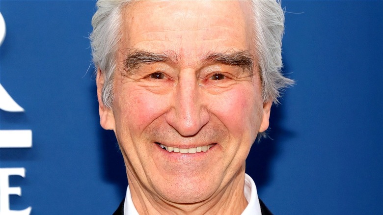 Sam Waterston smiling for photographers