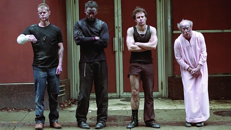 Riley, Leon, Pero, and Toto lined up on the sidewalk in "Welcome to Collinwood"