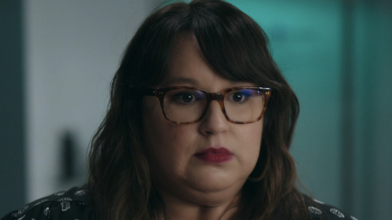 Jana Schmieding wears glasses and red lips