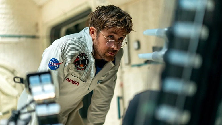 Dr. Ryland Grace inspecting a machine in Project Hail Mary (2026)