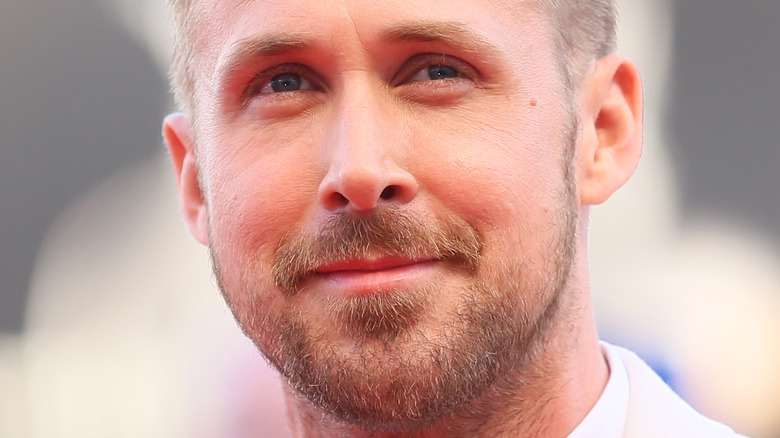 Ryan Gosling smiling, scruffy