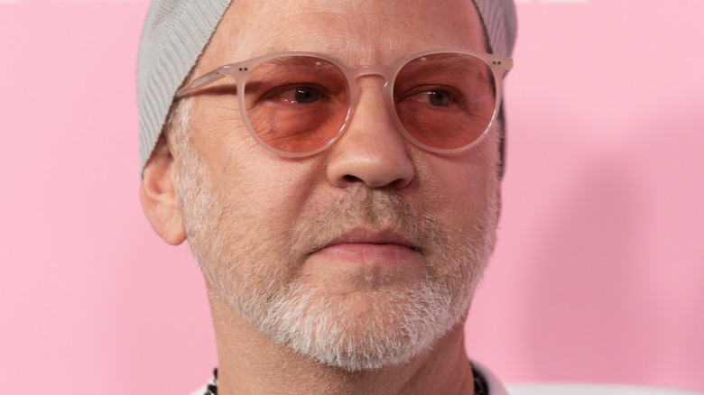 Ryan Murphy wearing a hat and glasses