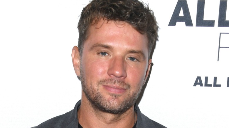 Ryan Phillippe smirking at event
