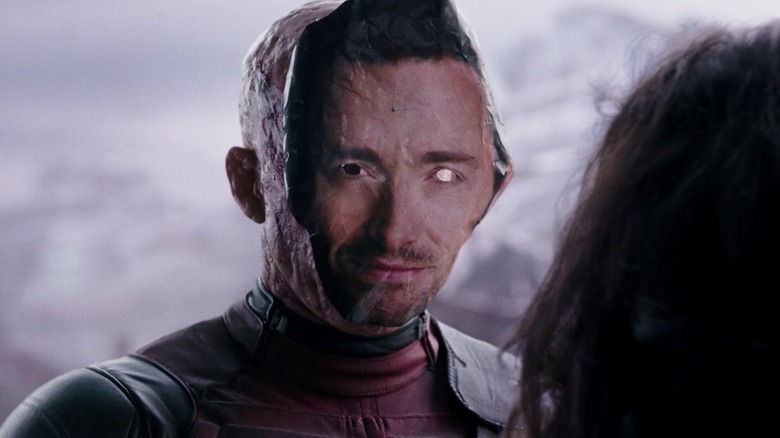 Deadpool wearing Hugh Jackman mask