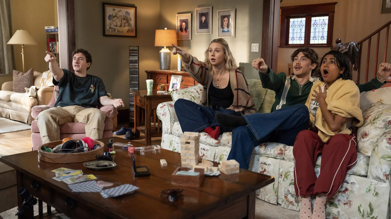 Samir Billie Paul Baker and Issa watching something on television on Adults