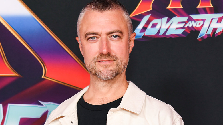 Sean Gunn looks to camera