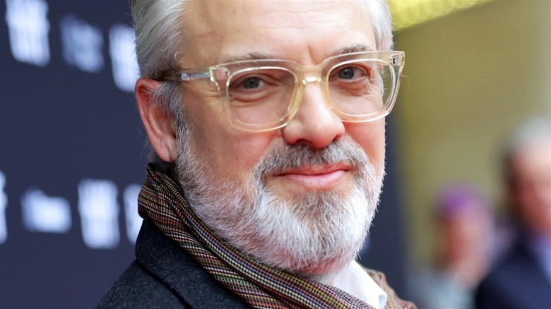 Sam Mendes looking over his shoulder at a movie premiere