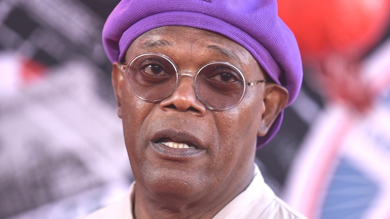 Samuel Jackson wearing purple hat  