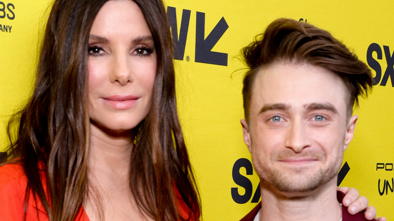 Sandra Bullock and Daniel Radcliffe posing together