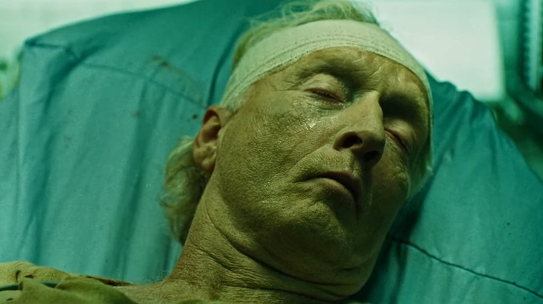 John Kramer lying in his makeshift hospital bed in "Saw III" (2006)