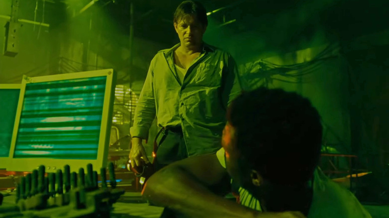 Detective Mark Hoffman looking down at Agent Rigg in "Saw IV" (2007)