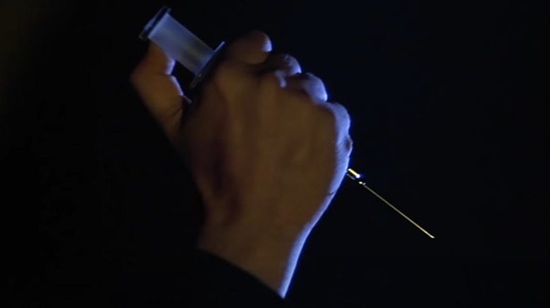 Michael stabbing with syringe