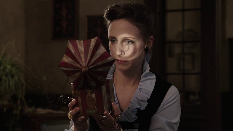 Lorraine Warren holds music box in "The Conjuring" (2013)