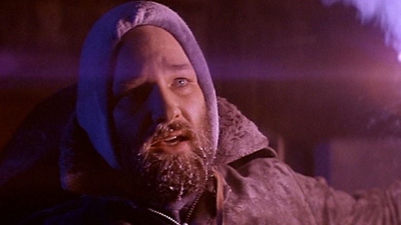 MacReady lights a torch in "The Thing" (1982)